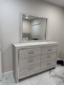 Signature Design by Ashley Altyra Modern Smooth-Gliding 6-Drawer Dresser and Mirror with Safety Stop.
