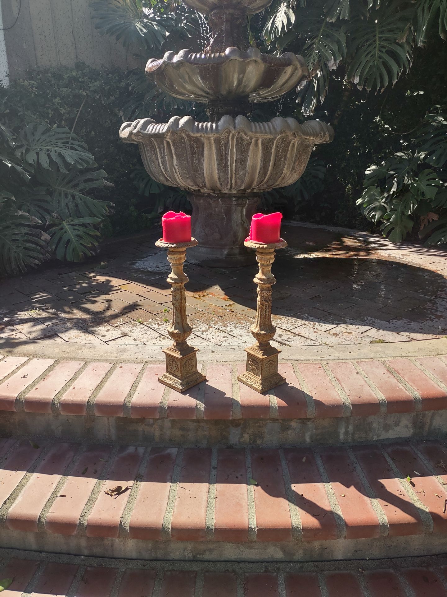 A pair of antique French cast iron single candle candle holders