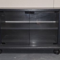 Black Rolling TV Stand / Media Console with Shelves and Glass Doors  
