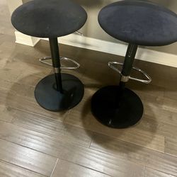 2 black Scan Design adjustable barstools