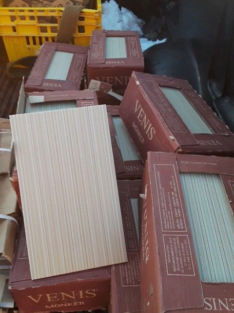 Nine boxes of Venis monker tile...one price
