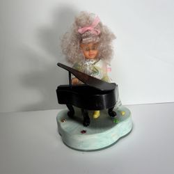 Musical Playing Piano Doll.