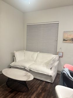 White Slipcovered Sofa Couch and Marbled Coffee Table