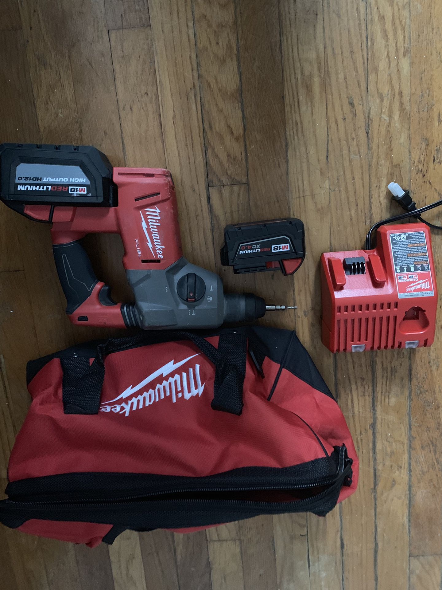 Milwaukee hammer drill. 2 batteries. Charger. Carrying bag