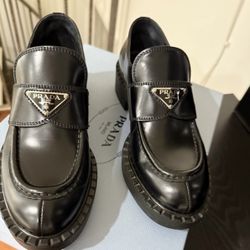 Prada Triangle Leather Loafers