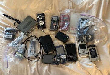 Box of phones, flip cameras, cassette player….TAKE ALL