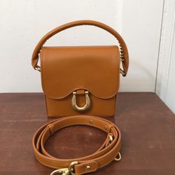 Sancia Medium Leather Gold Buckle Crossbody bag. New but without tag and dust bag . You can also find this post on Facebook market place with free shi