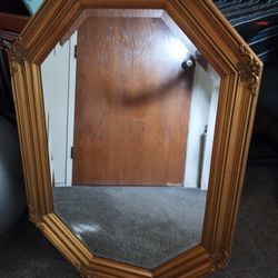 Large Framed Beveled Mirror With Ornate Wooden Frame.