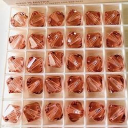 144 Swarovski 10mm bicone 5328 Beads in Rose Peach. 