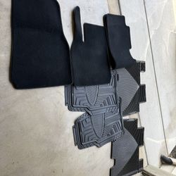 Assorted auto floor mats.