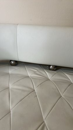 White beautiful leather sofa set with two sides table and one Revolving chair and decor