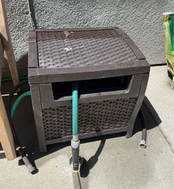 Hose reel with hose and nozzle