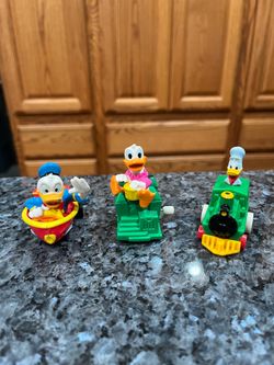 Vintage Disney lot of 3 Donald Duck Windup Toy Boat, Donald Duck and Daisy on train cars.  Works good.  Size 3 inches wide and 2, inches tall. Preowne