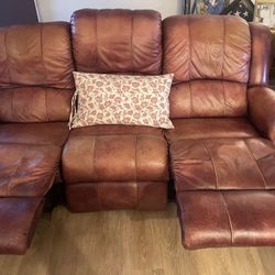 Rust colored  brown Leather  reclining Sofa & love seat  Need to 