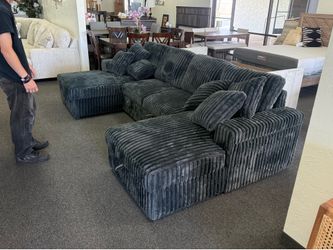 Sleeper sectional with storage chaise and storage arms