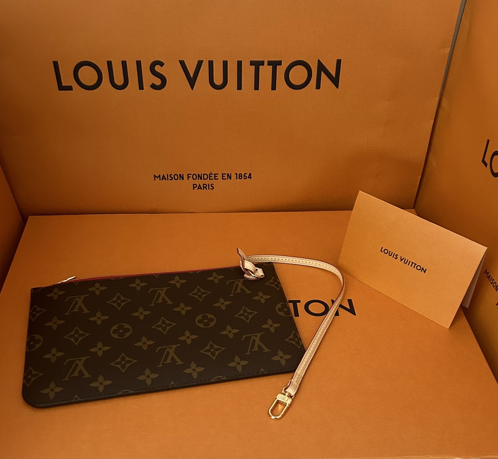 New authentic Louis Vuitton Neverfull Clutch