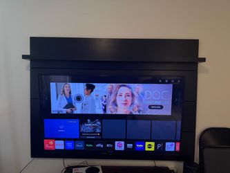 Black Wood TV floating Wall mount Panel with Shelf And 65in smart TV