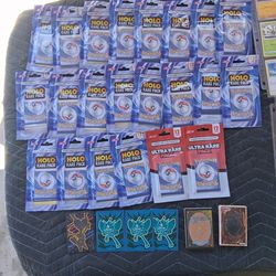 22 Unopened 12card deck Pokémon packs, 44 Pokémon cards in trading card sleeves. (1) 27card YuGiOh mystery deck, 1. 27card Magic The Gathering mystery