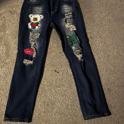 Navy blue jeans with embroidered patches