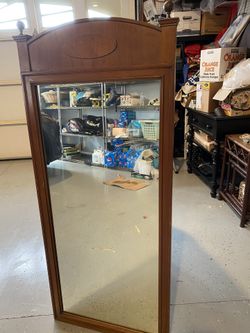 Solid wood mirror.