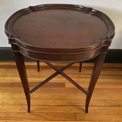 1905 rosewood side table with a cross stretcher base and gallery edge