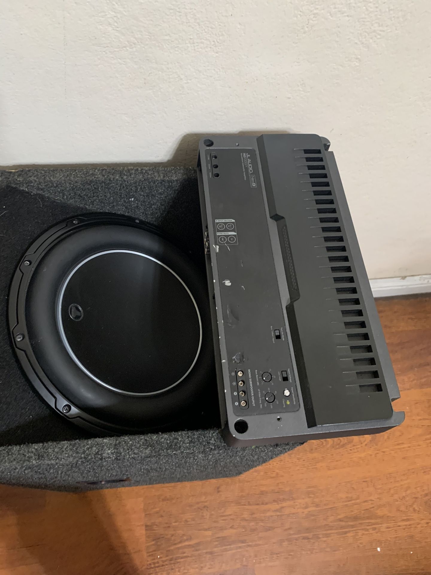 JL AUDIO 12” WITH A 1000 WATT AMP