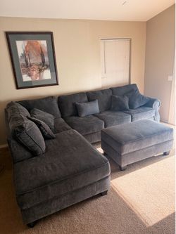 Sectional couch with recliner and armoire