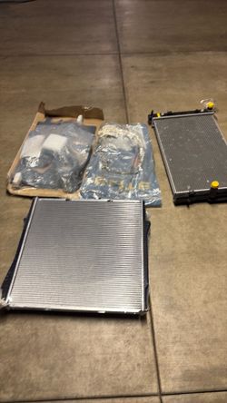 2 Radiators,Power steering hose and a Cooling Fan(NEW)