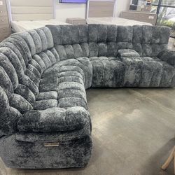 New Power Reclining Sectional.  Grey Fabric.  89x101x40H.  St Ht 20”. St DP 23.5”H.  Free Delivery!