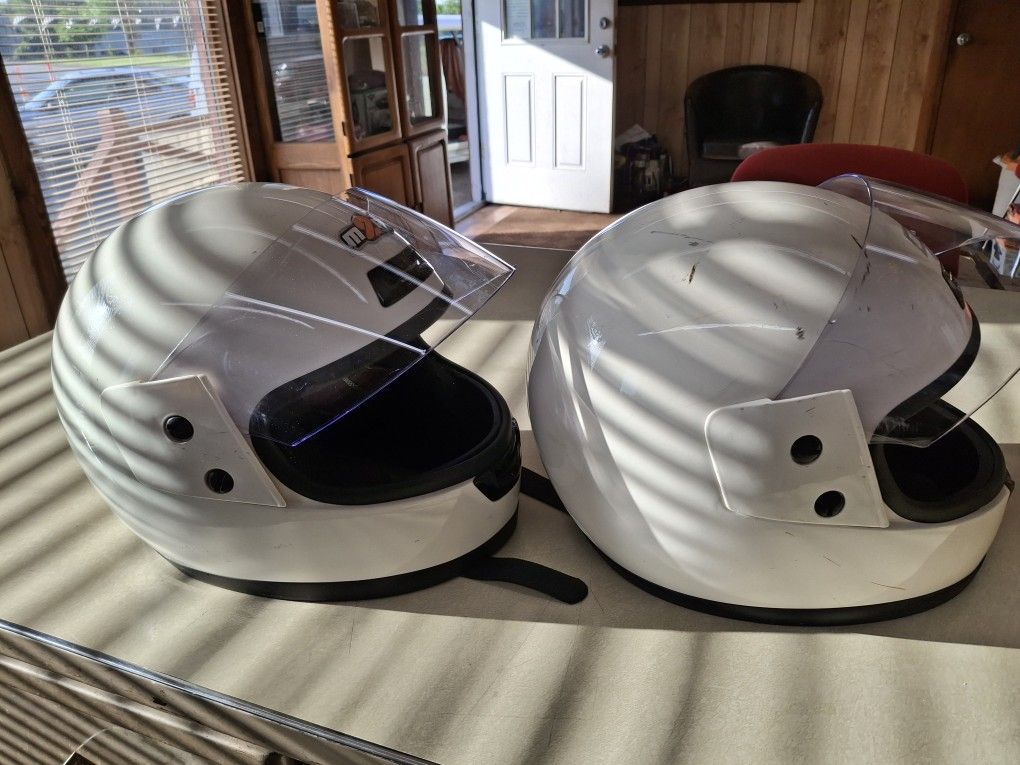 Two NICE Black And WHITE Helmets Good Condition THE inside Of THEM Are LIKE NEW
