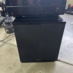 Yamaha RX-V673 7.2-channel AV receiver stacked on a BIC Acoustech powered subwoofer