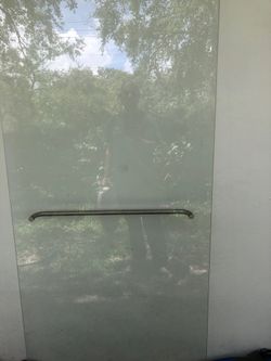 Shower door with hardware