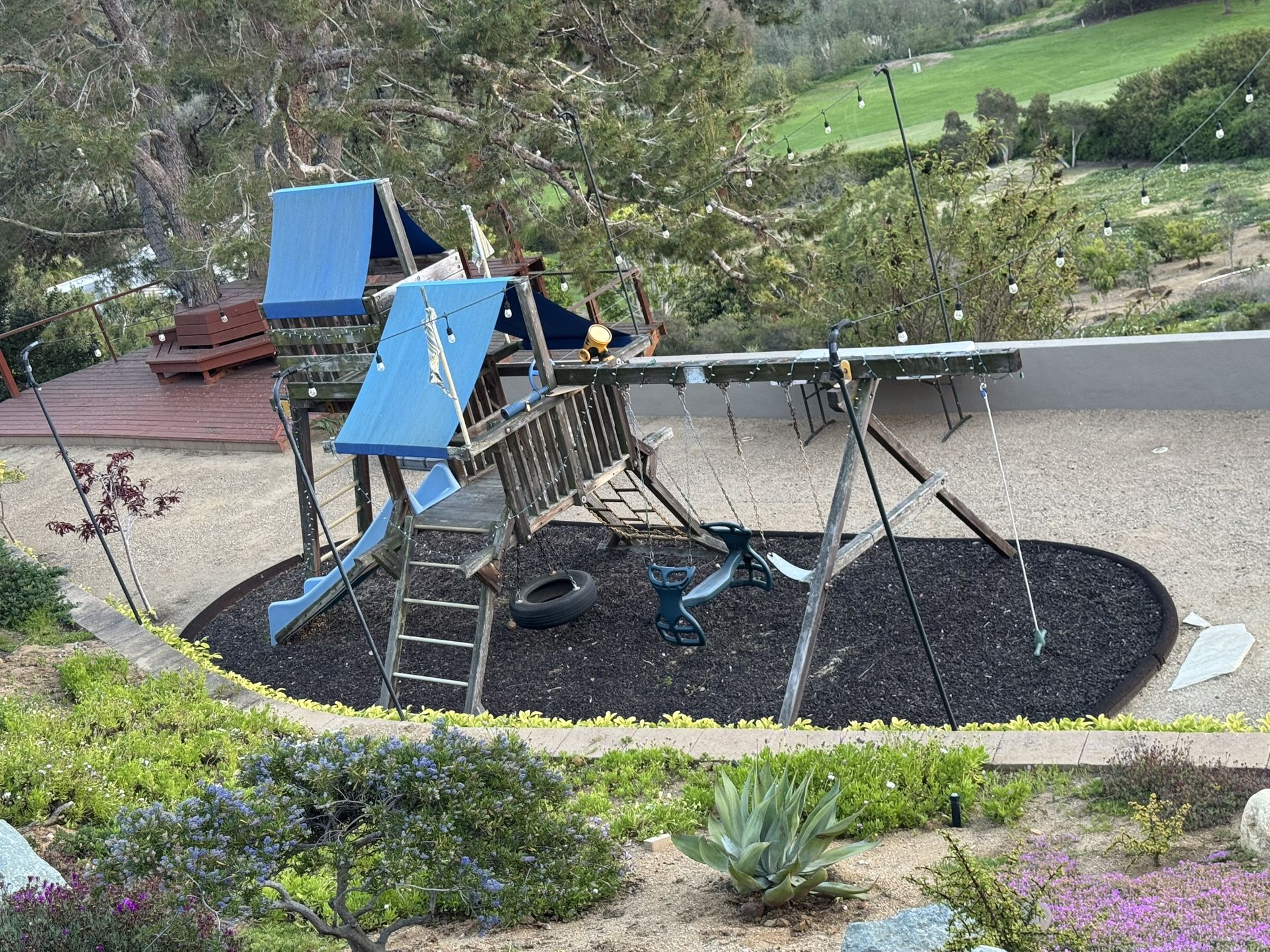 Rainbow Playground Structure. Includes Rubber Enclosure And Rubber Mulch