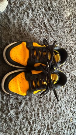 Black and yellow Nike shoes
