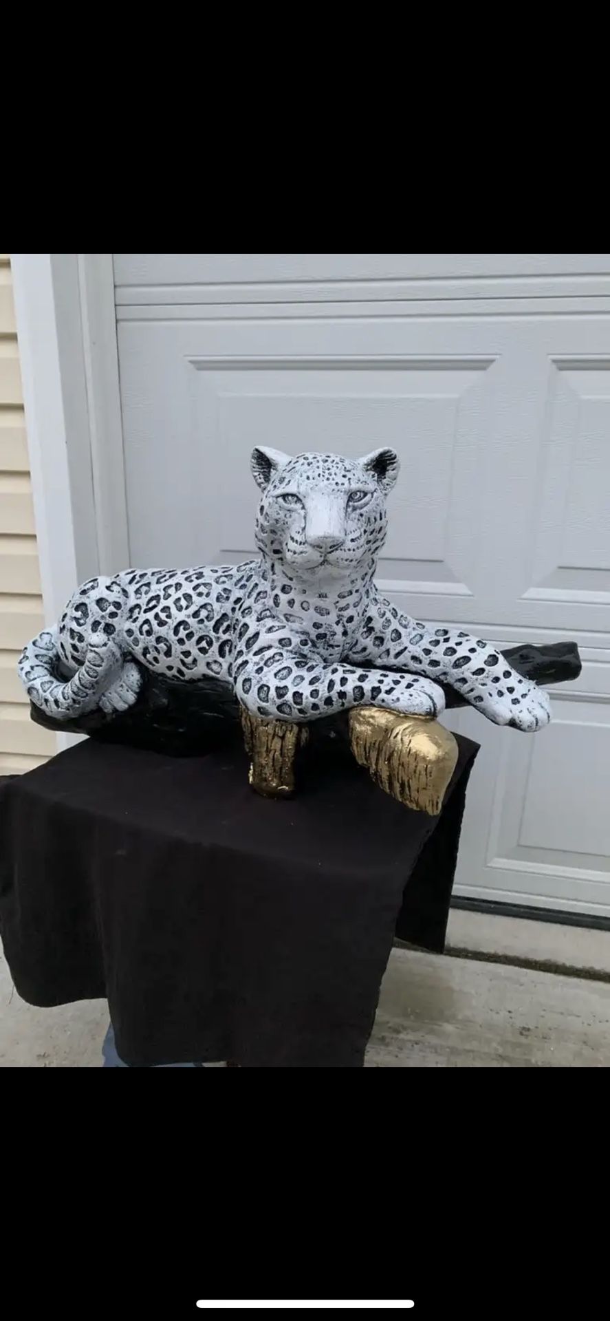 Snow Leopard On The Log