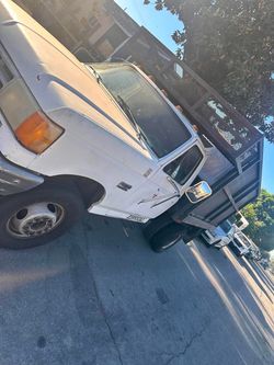 White Flatbed Work Truck with Rack