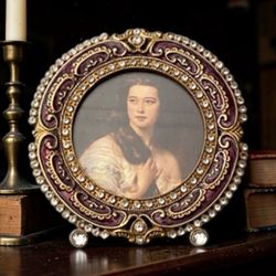 Gorgeous ornate, jeweled tabletop picture frame, a type of decorative home accessory often produced by luxury brands like Jay S