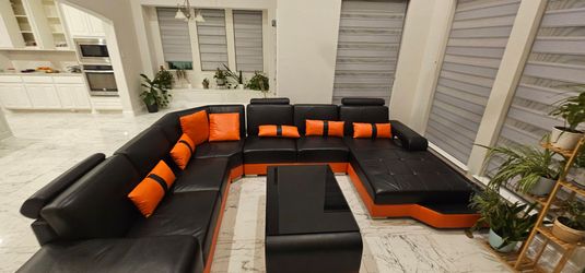 Black and orange sofa with center table