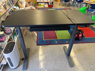 Black adjustable height desk 48” x 24”