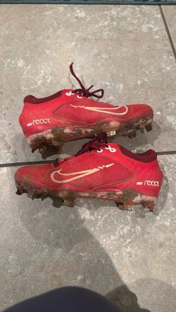 Red Metal cleats Size 5