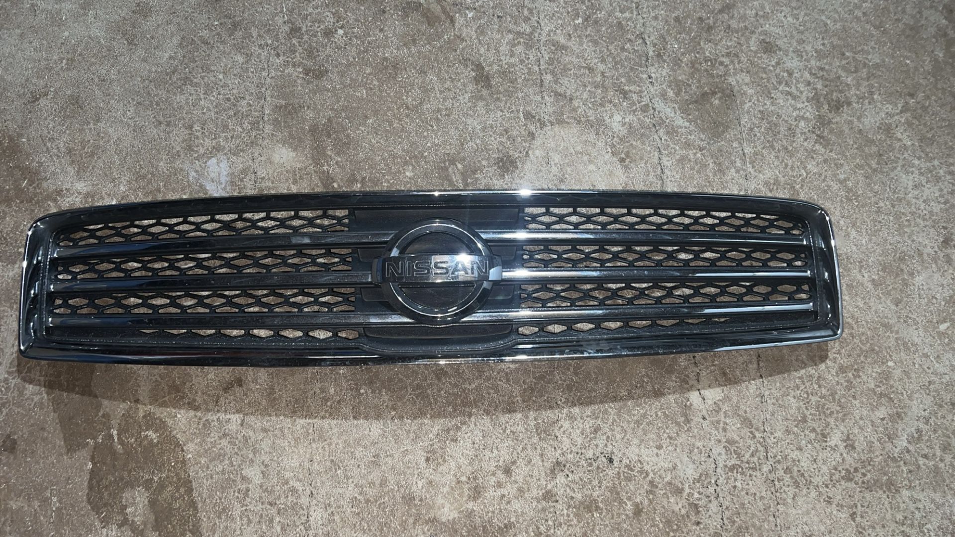 Front grille for a Nissan Maxima