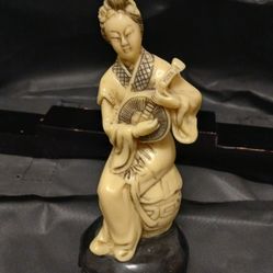 Chinese carved ivory figurine of a woman playing a pipa