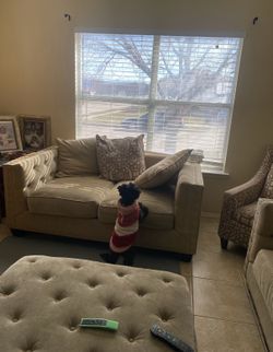 Cindy Crawford Tan couch set with matching ottoman. Slightly used and still in good condition. Very soft and comfortable with only minor stains.(CHAIR