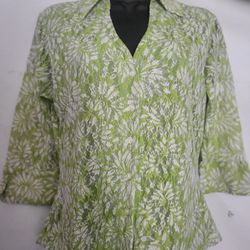 Green and white floral blouse