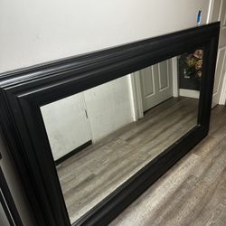 black miorr with wood on the side