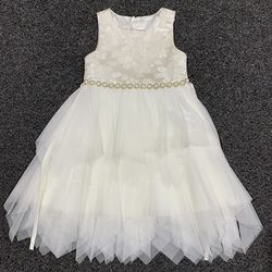 Beautiful American Princess ivory textured floral bodice and a multi-layered tulle skirt with a "hanky hem" (jagged edge) dress with rhinestone or fau