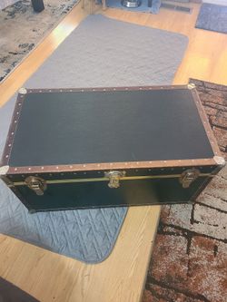 Black chest with gold accent