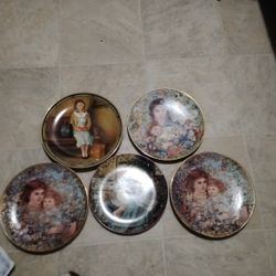 collection of decorative collector plates from the 1989 "The Bonds of Love" series by Brenda Burke. These plates were produced by W.S. George Fine Chi