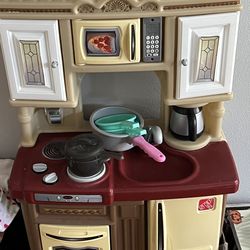 Kid kitchen with food and shopping cart