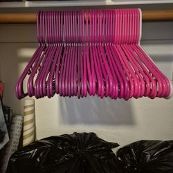 Tons Of Pink Plastic Hangers